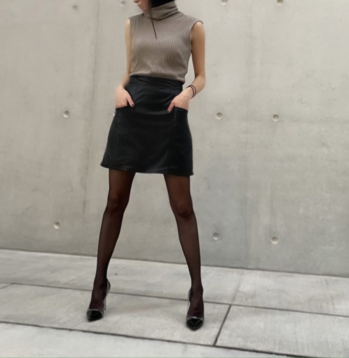 mini vegan leather skirt with pockets and turtleneck shirt